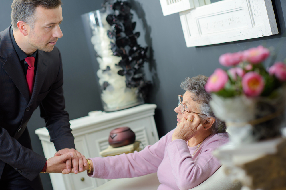 Funeral director comforting a family member with care and compassion