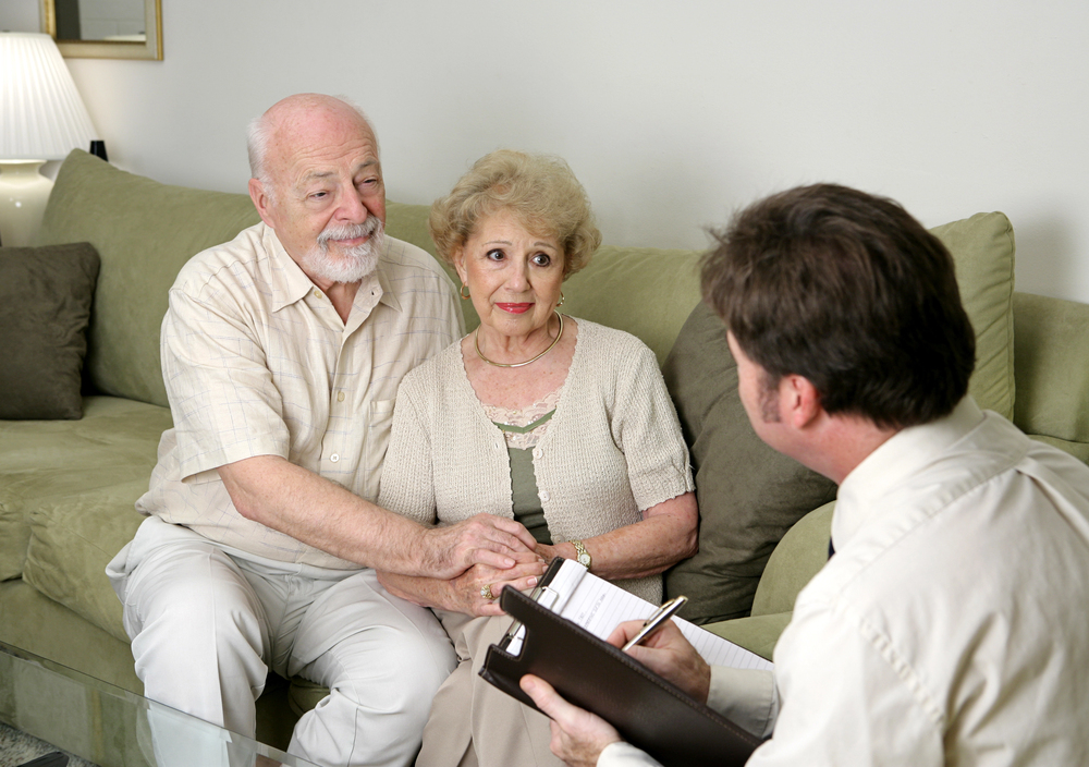 Funeral director meeting with a family in a warm, comfortable setting